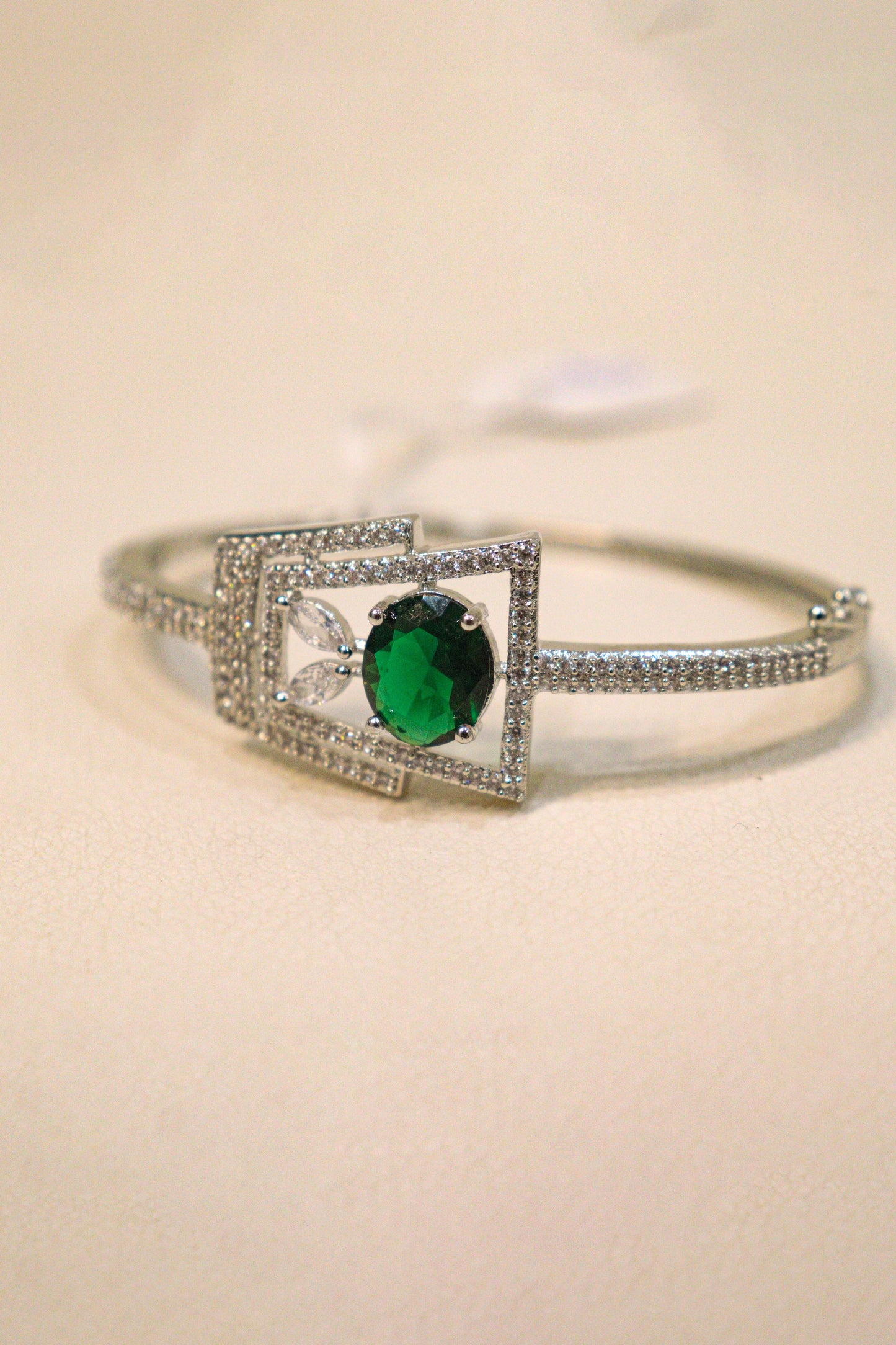 Punisha: Radiant Rhodium AD Bracelet with Emerald Stone