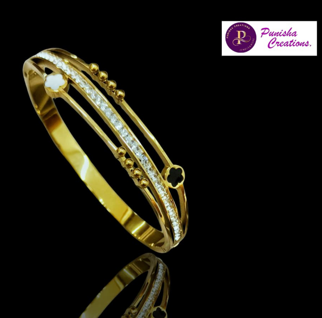 BRC25 33s Timeless Elegance: Gold-Plated Openable Bracelet with Chic Accents